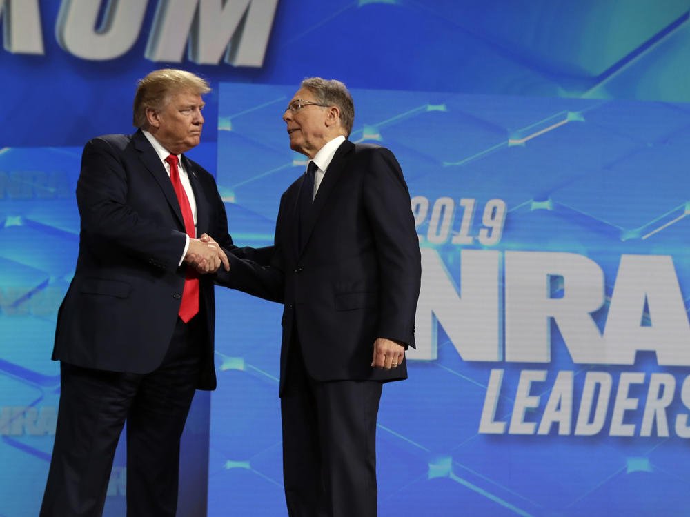 President Donald Trump shakes hands with NRA Executive Vice president and CEO Wayne LaPierre, at the annual meeting of the National Rifle Association on April 26, 2019, in Indianapolis. The NRA is going ahead with its annual meeting in Houston just days after the shooting massacre at a Texas elementary school.