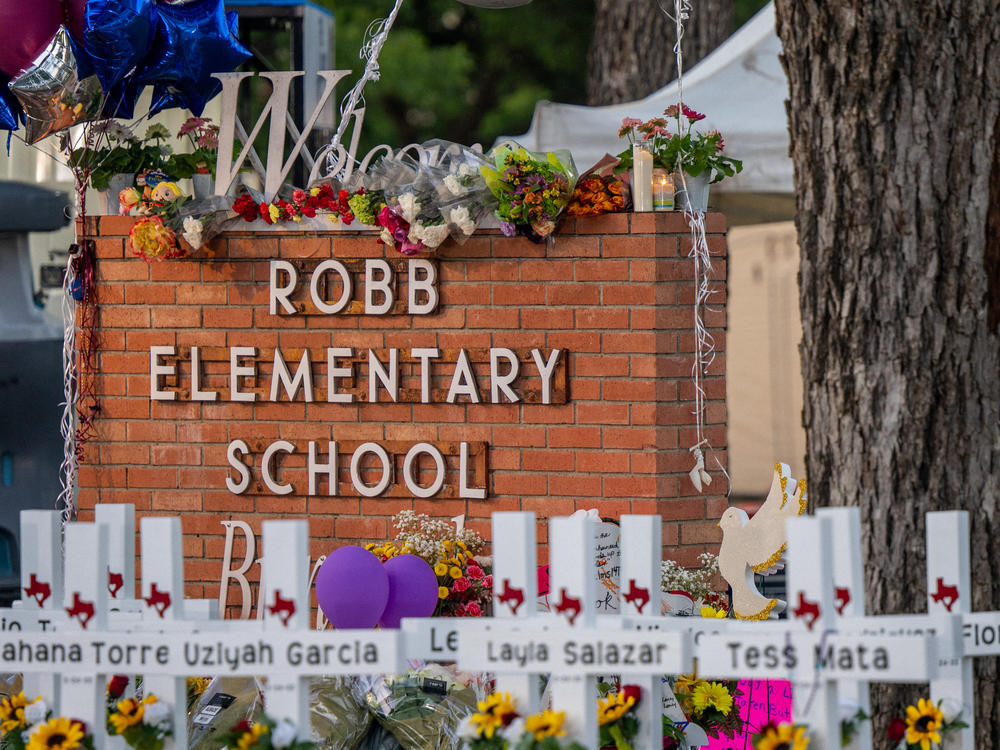 A memorial is seen outside Robb Elementary School in Uvalde, Texas, following the attack there this week in which 19 students and two adults were killed.