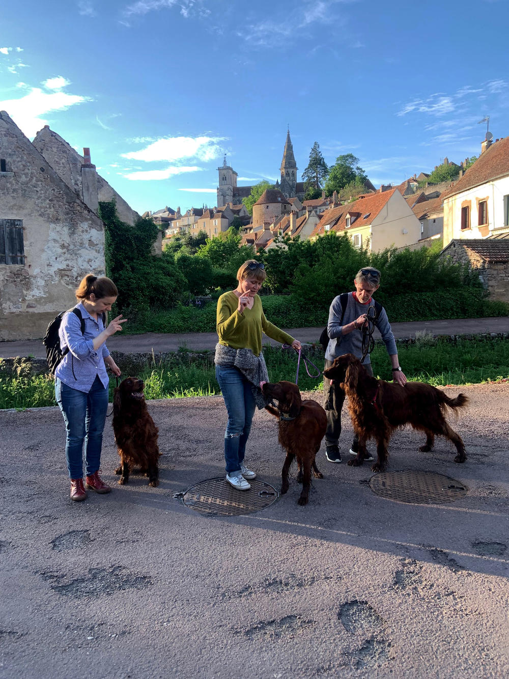 Vlada, Yuri Mazurenko and Macha Levitin are on a walk with their dogs Iris, Rolly and Safra.