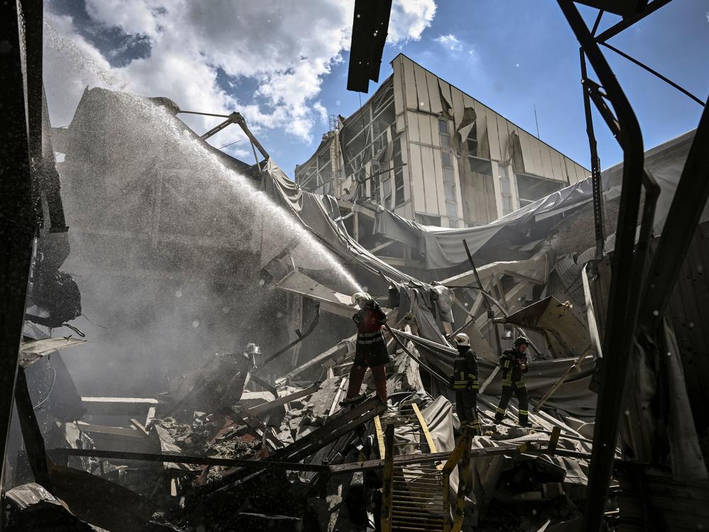 Firemen extinguish a fire at a gypsum manufacturing plant after shelling in the city of Bakhmut, in the eastern Ukrainian region of Donbas, on Friday. Russia pressed on with a deadly offensive to capture key points in the Donbas this week.