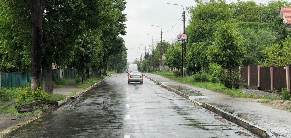 Here's the same view of Vokzal'na Street on Monday. You can see the red-and-blue sign for the ATB market in both photos on the upper right. Ukrainians in Bucha have removed all the destroyed vehicles and debris from the streets, which are open to normal traffic.