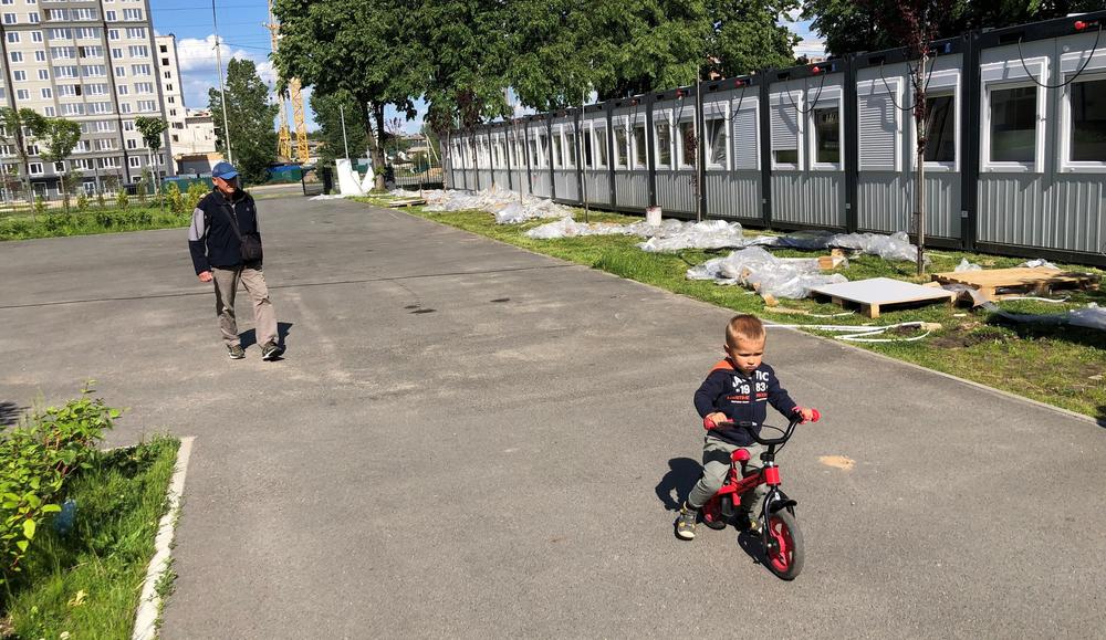 This prefabricated dorm, on the right of the photo, has been placed in a schoolyard. The school was damaged by the Russians and is closed, but kids are on the surrounding playgrounds throughout the day.