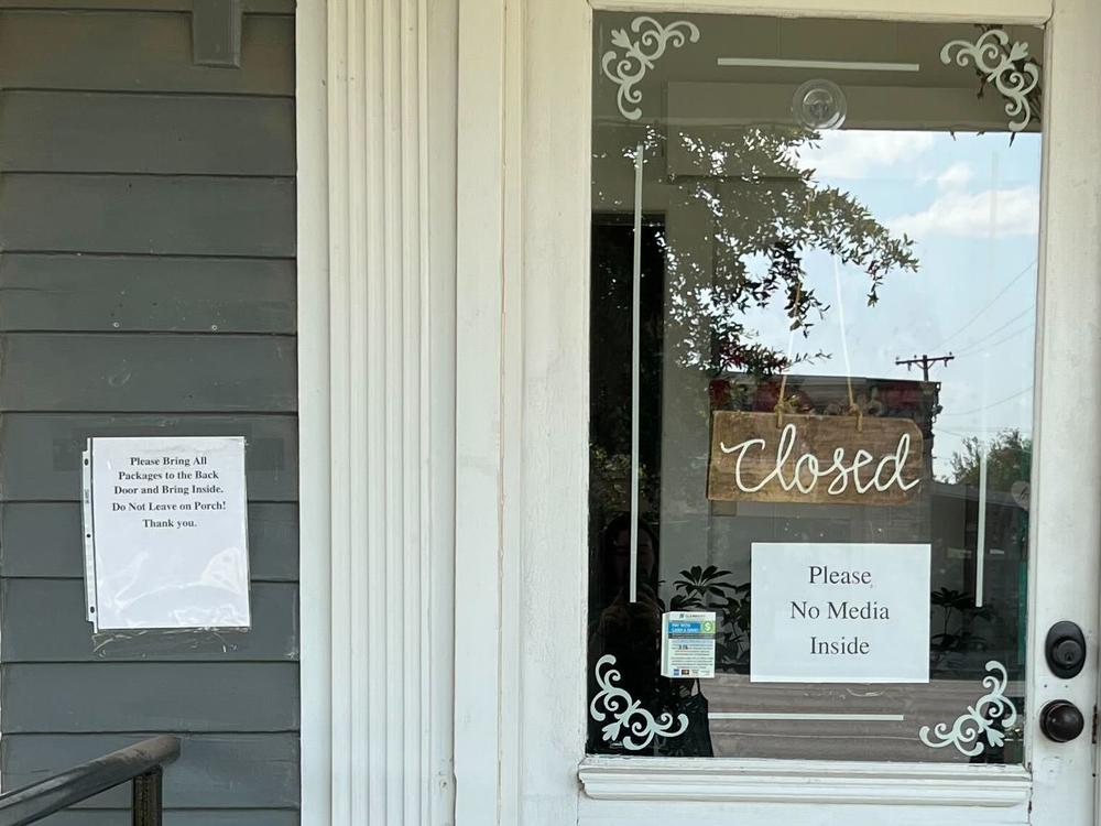 The flower shop is closed temporarily as florists work around the clock to make wreaths and other arrangements for the services.