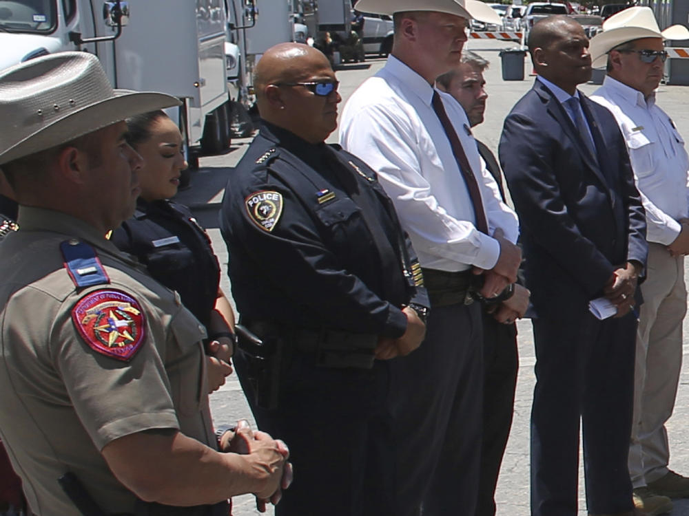 Pete Arredondo, Uvalde school police chief, third from left, stands during a news conference outside of the Robb Elementary school in Uvalde, Texas, on May 26.