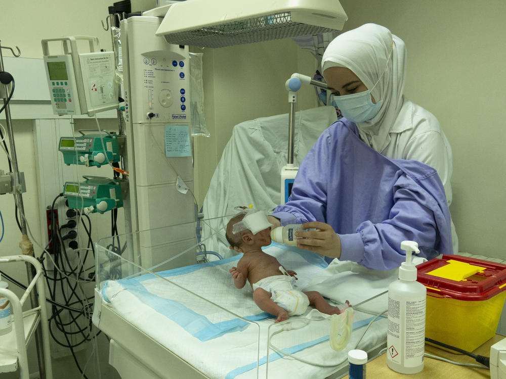 A baby receives care in the neonatal intensive care unit of the government hospital in Tripoli, Lebanon. Because of the lack of prenatal care amid the country's massive economic crisis, medical staff members say more newborns are born sick and weak. From time to time, when parents don't have the funds to pay for additional care, they go home — and leave their infant stranded at the hospital.