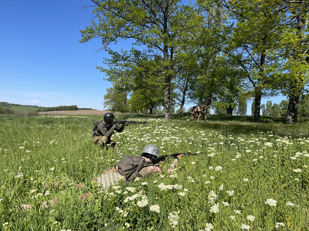 Members of the Khartia battalion practice maneuvers outside Kharkiv in mid-May.