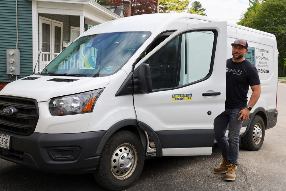 Oleg Opalnyk climbs into his work van after checking in on the Ukrainian families living at the apartment building he owns in Auburn, Maine. Opalnyk says supporting the families can feel overwhelming at times, but that he's thankful to be able to help.
