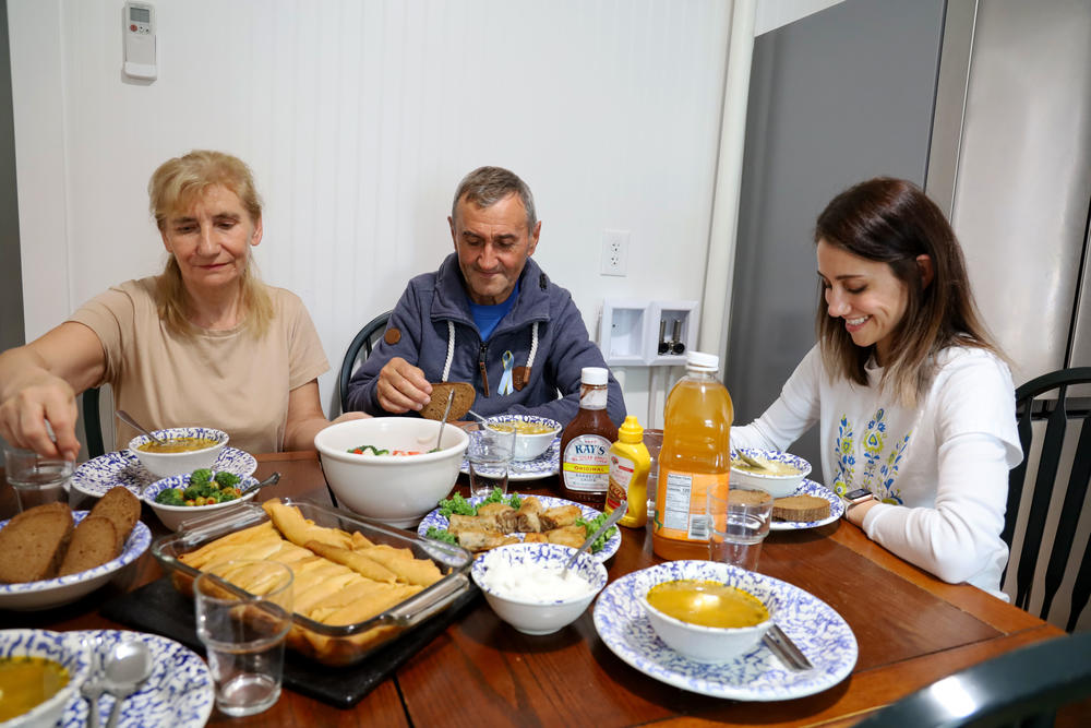 Halyna Terzi, from left, with her husband Petro and their daughter Alina, eating lunch shortly after Halyna and Petro arrived in Maine.