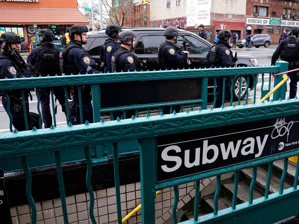 Members of the New York Police Department patrol the streets after a rush-hour shooting at a subway station in Brooklyn on April 12.
