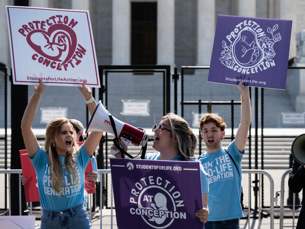 Anti-abortion activists protest outside the U.S. Supreme Court on Monday, May 23.