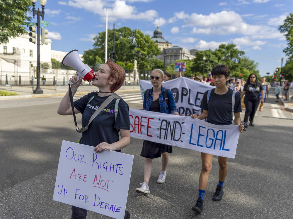 Protesters march near the U.S. Supreme Court to call for abortion rights protection on May 28 in Washington, D.C.