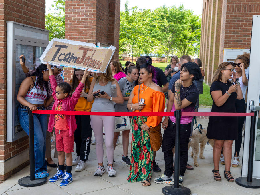 Fans of Johnny Depp gather outside the Fairfax County Circuit Courthouse in Fairfax, Va., on Wednesday.