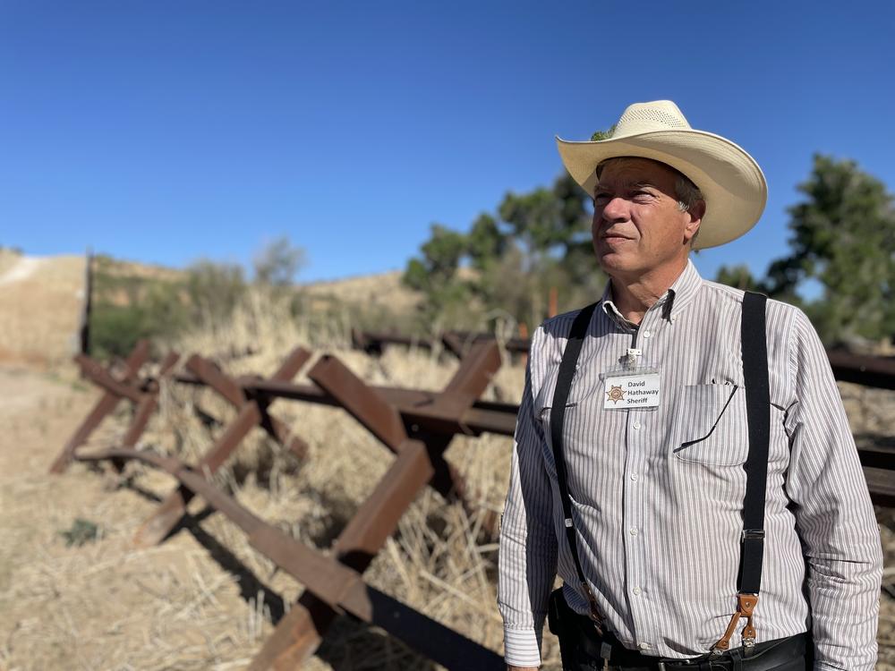 Along the US Mexico border near Nogales, Santa Cruz County Sheriff David Hathaway says national politicians stoke fears of a migrant 