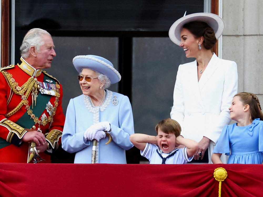 Britain's Queen Elizabeth II, Prince Charles and Catherine, Duchess of Cambridge, along with Princess Charlotte and Prince Louis appear on the balcony of Buckingham Palace as part of the Trooping the Color parade during the queen's Platinum Jubilee celebrations.