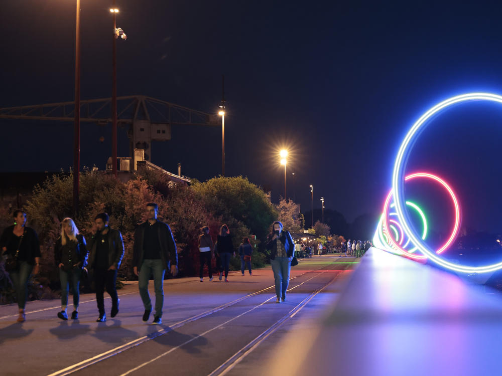 Youths walk on quay Des Anneaux near the Warehouse nightclub, Wednesday, May 18, 2022 in Nantes, western France.