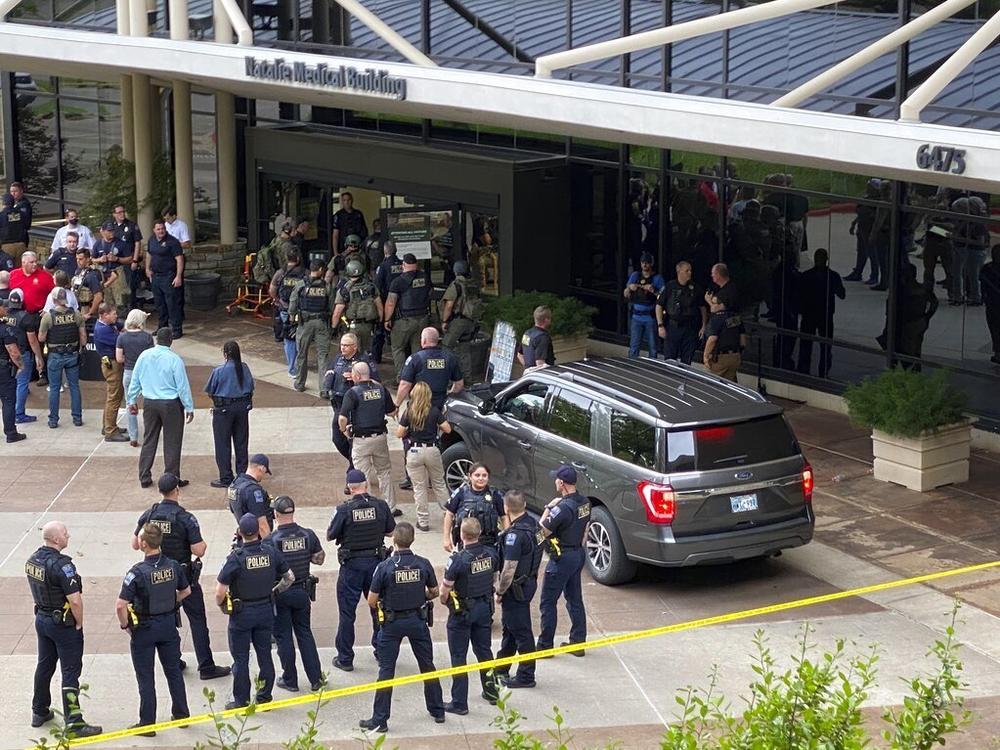 Emergency personnel respond to a shooting at the Natalie Medical Building on Wednesday in Tulsa, Okla.
