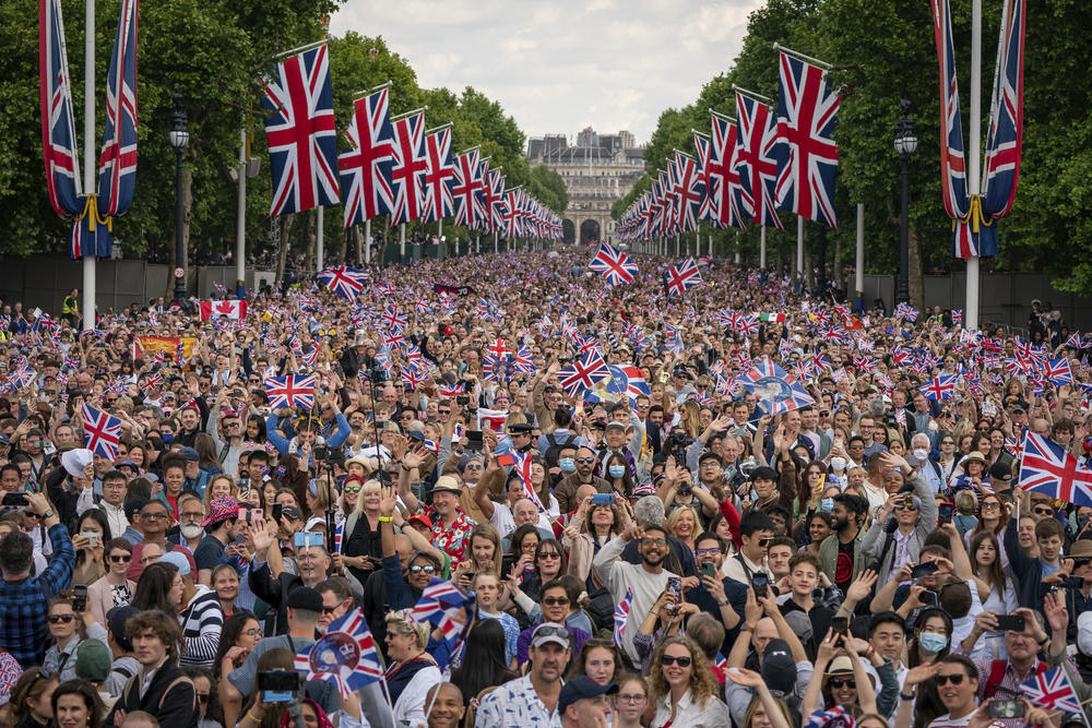 People pack the Mall as the British Royal family appears on the balcony of Buckingham Palace after the Trooping the Color ceremony in London.