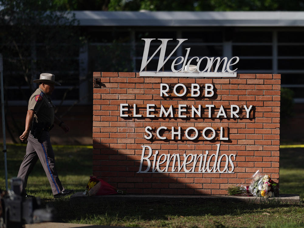 An officer walks outside of Robb Elementary School in Uvalde, Texas, on May 25.