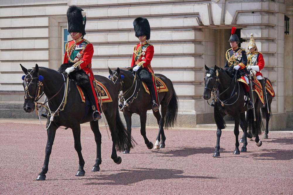 Britain's Prince Charles (left), Prince William (center) and Princess Anne (second from right) leave Buckingham Palace on their way to the queen's birthday parade.