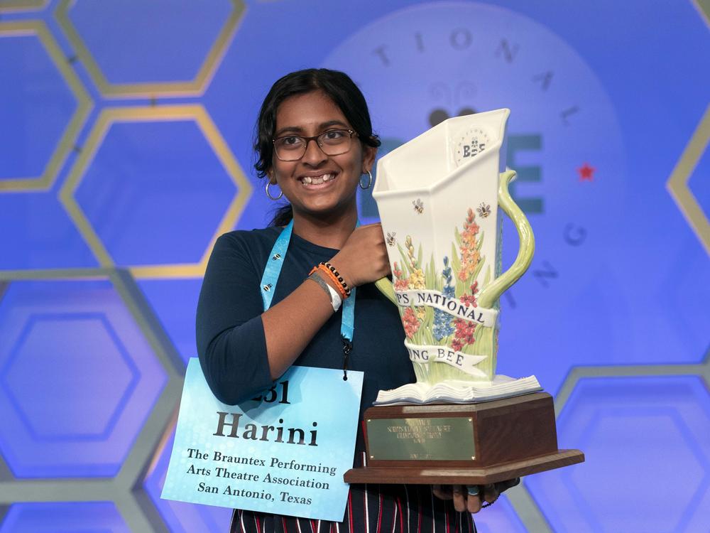 Harini Logan, 14, from San Antonio, Texas, holds her winning Scripps National Spelling Bee trophy, Thursday, June 2, 2022, in Oxon Hill, Md.
