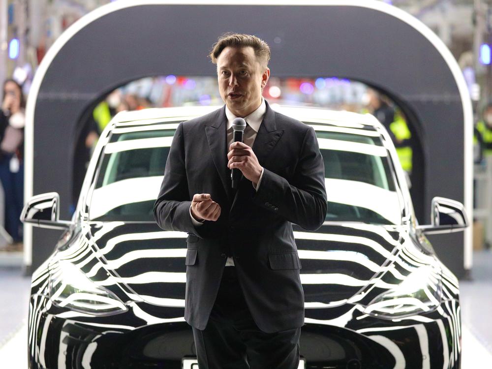 Tesla CEO Elon Musk speaks during the official opening of the new Tesla electric car manufacturing plant near Gruenheide, Germany, on March 22. Musk reportedly wants to lay off 10% of staff because of his worries about the economy.