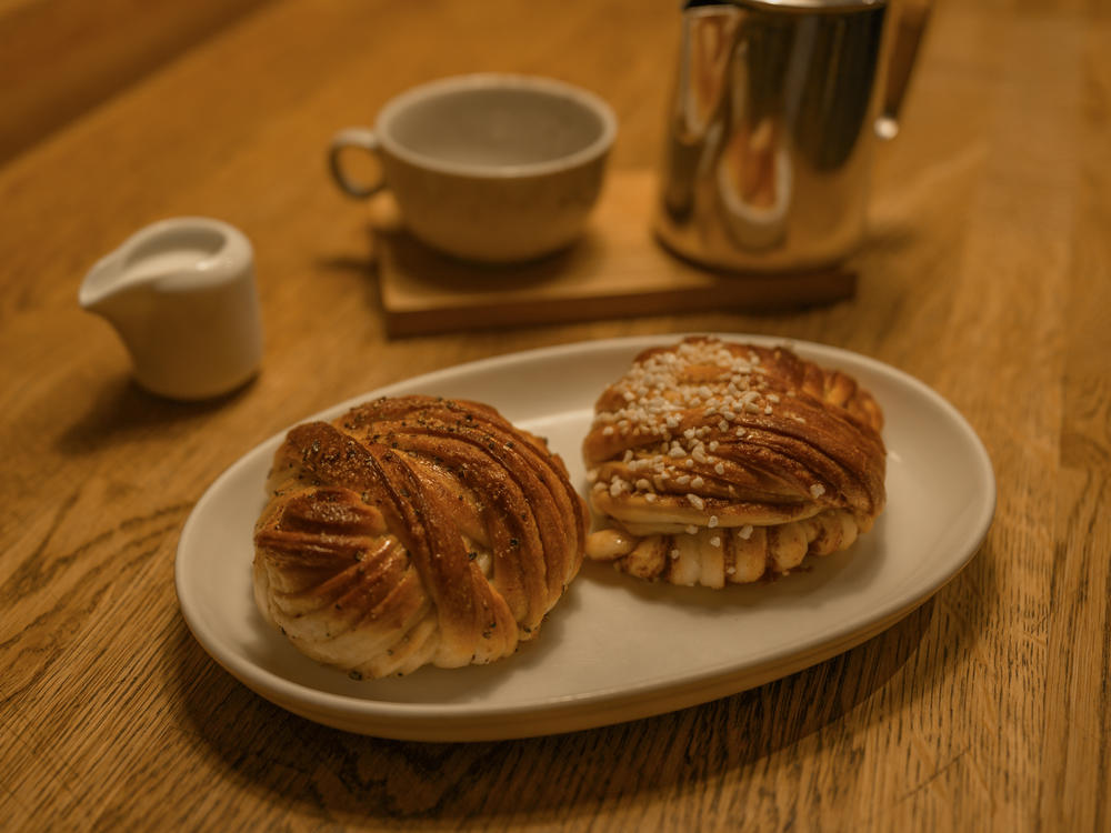 Cinnamon and cardamon bun served in a Swedish cafe, often eaten at <em>fika </em>– a Swedish word that's often translated as 