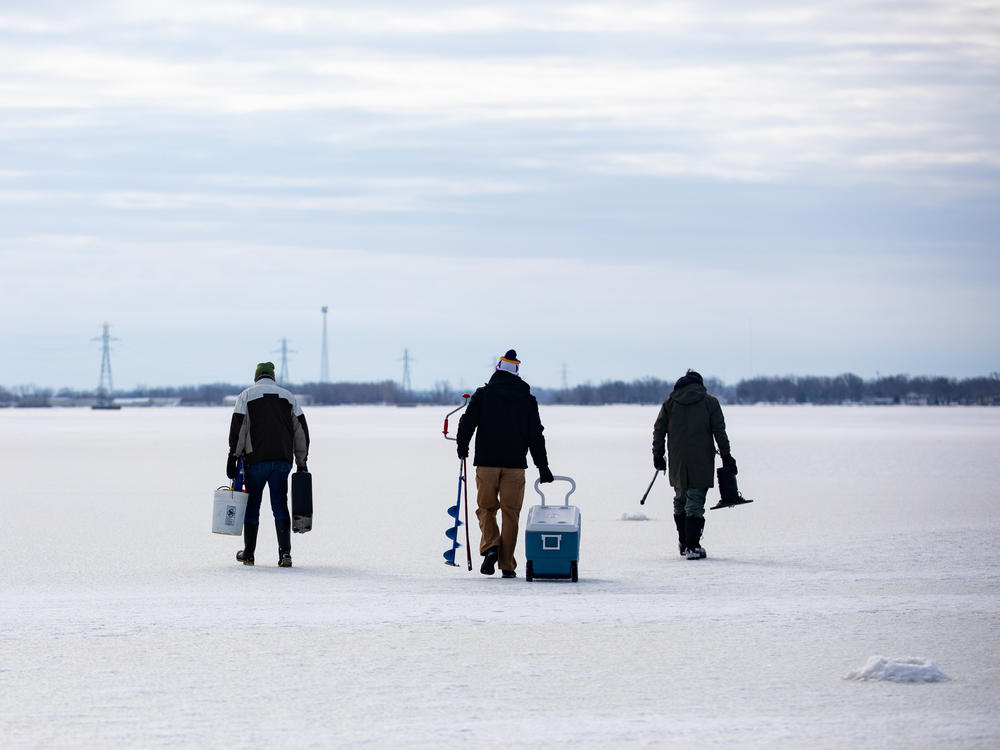 From left: Bowling Green State University emeritus biology professor George Bullerjahn, Bowling Green graduate student Ryan Wagner and University of Windsor professor Mike McKay set out on the frozen surface of Lake Erie's Sandusky Bay to find a spot to collect water samples on Feb. 9 near Port Clinton, Ohio.