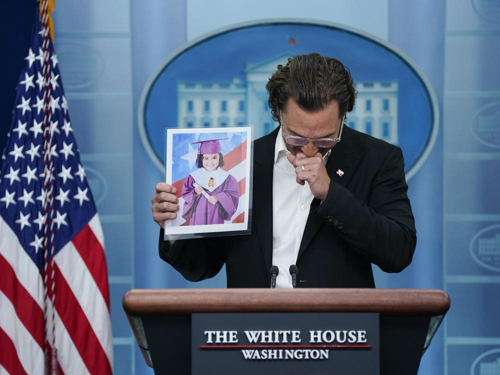 Actor Matthew McConaughey holds an image of Alithia Ramirez, who was killed at age 10 in the school shooting in Uvalde, Texas, as he speaks during a press briefing at the White House on Tuesday.