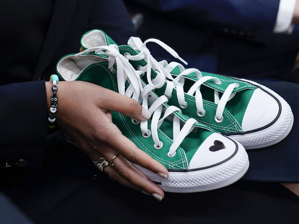Camila Alves McConaughey holds green Converse sneakers. Uvalde, Texas, school shooting victim Maite Rodriguez, who died at age 10, was wearing green Converse shoes when she died.
