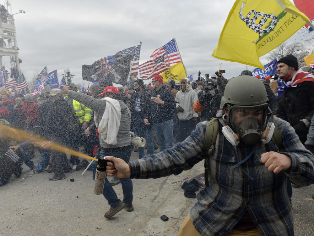 Trump supporters clash with police and security forces as rioters try to storm the U.S. Capitol on Jan. 6, 2021.