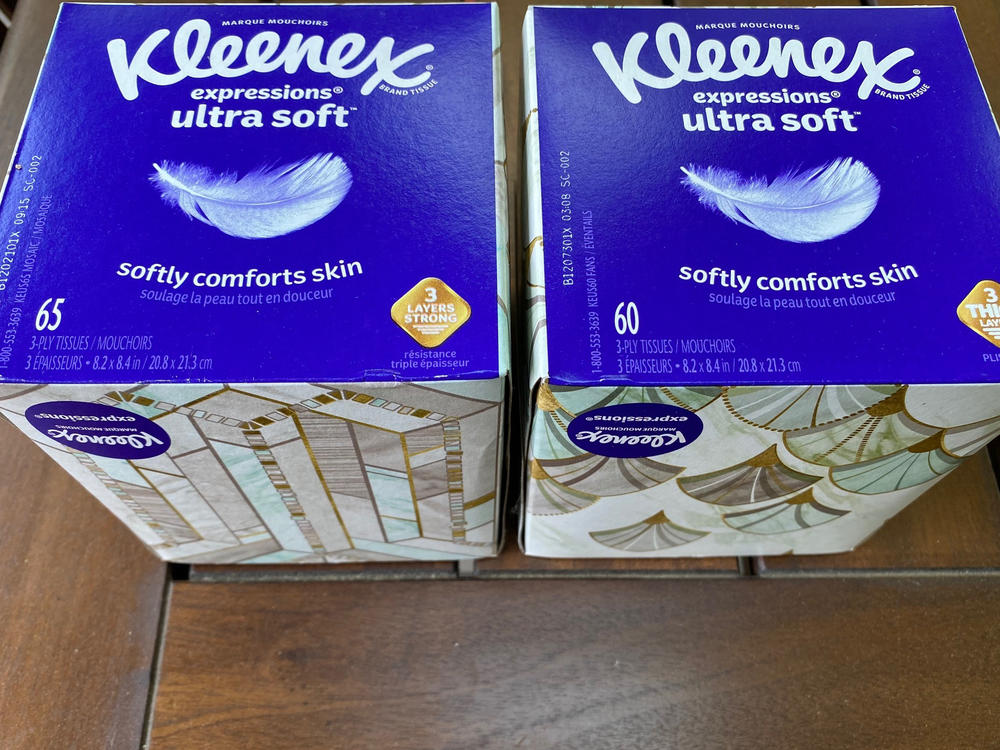 Two boxes of Kleenex tissues are displayed in Ann Arbor, Mich., on May 25. In the U.S., a small box of Kleenex now has 60 tissues; a few months ago, it had 65.