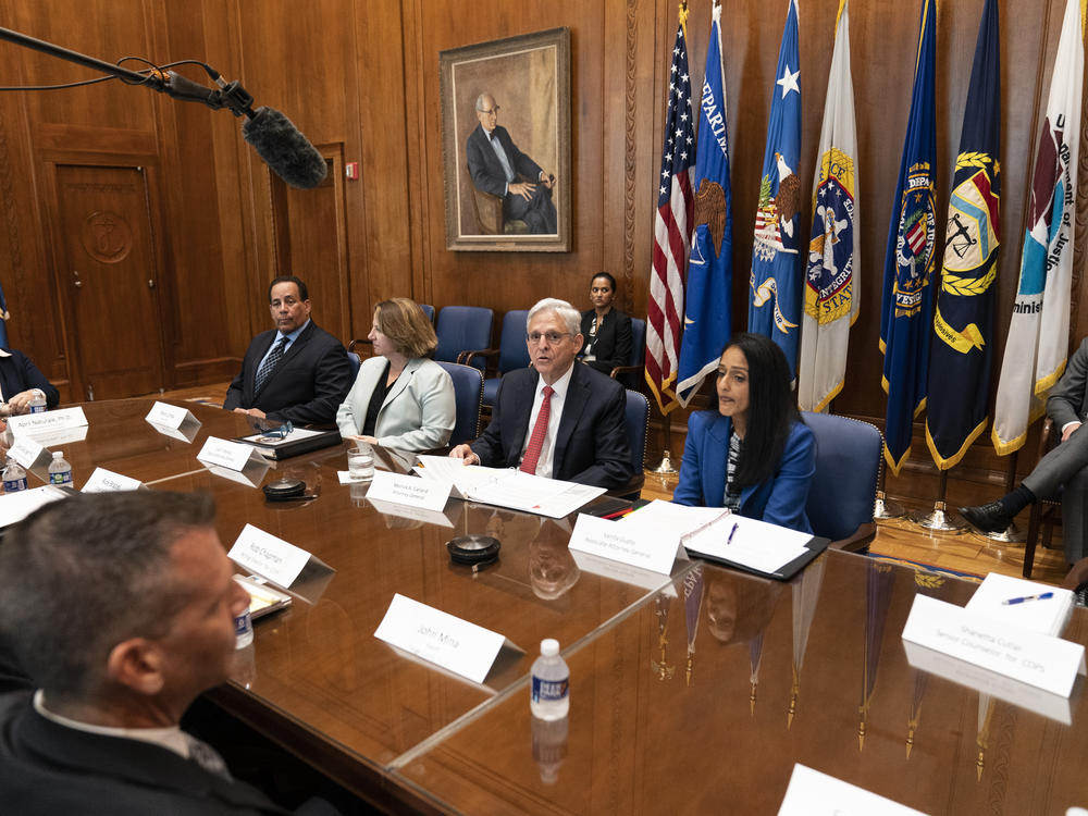 Attorney General Merrick Garland, third from left, speaks at the Department of Justice Wednesday to announce a team to conduct a critical incident review of the mass shooting in Uvalde, Texas.