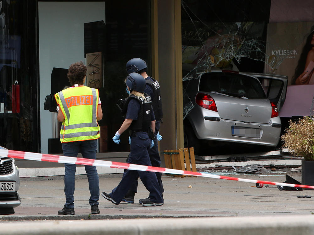 Police block the site where a car crashed into a crowd and then a shop. At least one person was reportedly killed, with others injured when a car drove into a group of people at the busy shopping district in Berlin on Wednesday, police said.