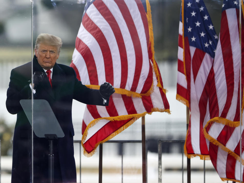 Former President Donald Trump greets the crowd at the 