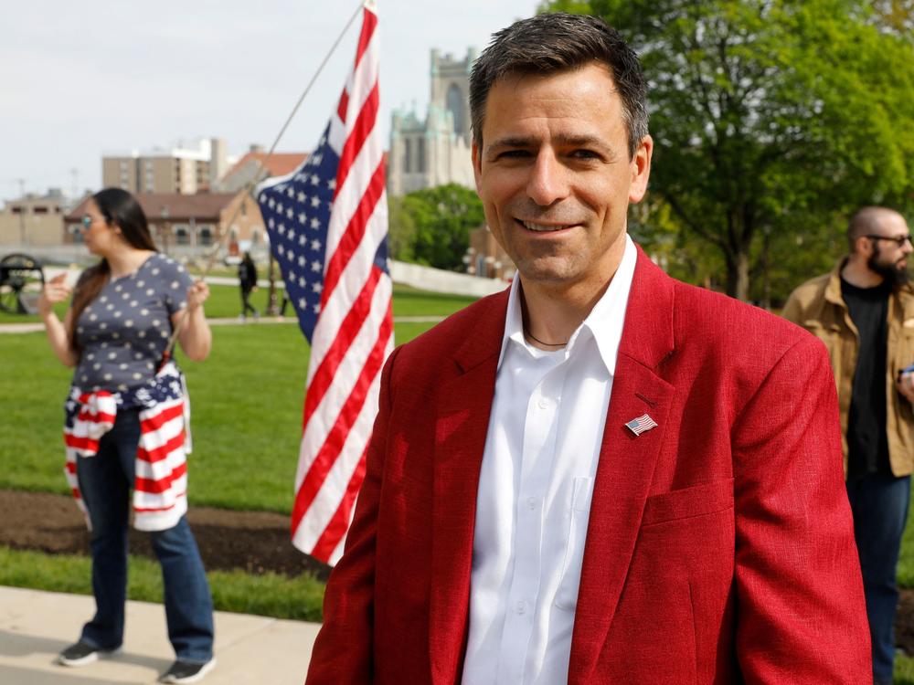 Ryan Kelly, a Republican candidate for governor, attends a rally in support of First Amendment rights and to protest against Gov. Gretchen Whitmer, outside the Michigan State Capitol in Lansing, Mich., on May 15, 2021.