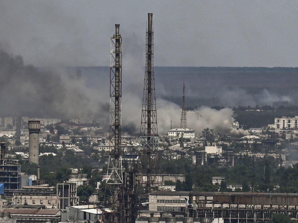 Black smoke and soot rise from the city of Sievierodonetsk, eastern Ukraine, during a battle between Russian and Ukrainian troops on Thursday. Ukraine's leader has called it the epicenter of the fight for the Donbas region.