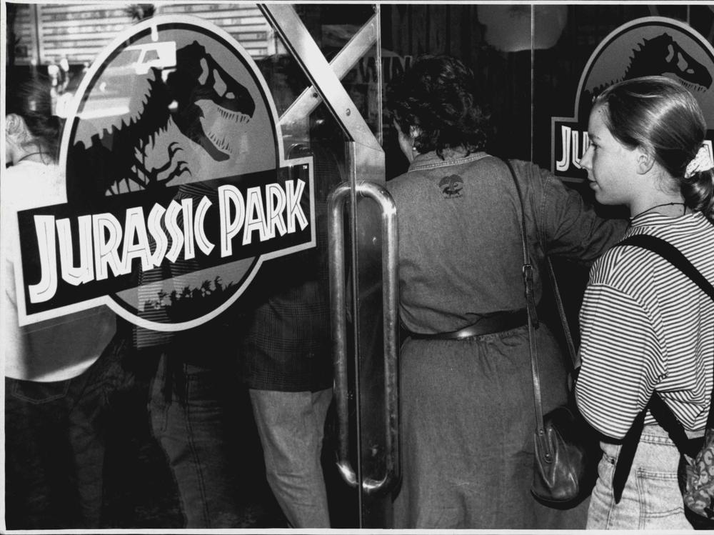 A crowd entering the theater to see <em>Jurassic Park</em>, photographed on October 5, 1993.