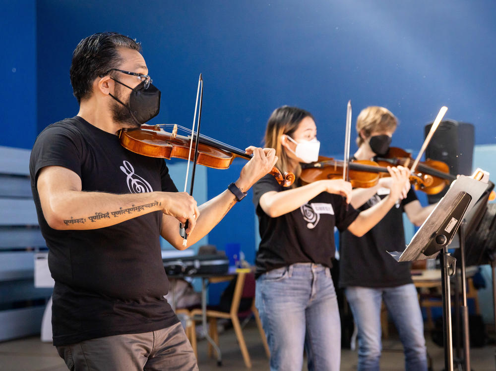 Vijay Gupta performing with some of the professional musicians in Street Symphony at the Midnight Mission on LA's Skid Row.
