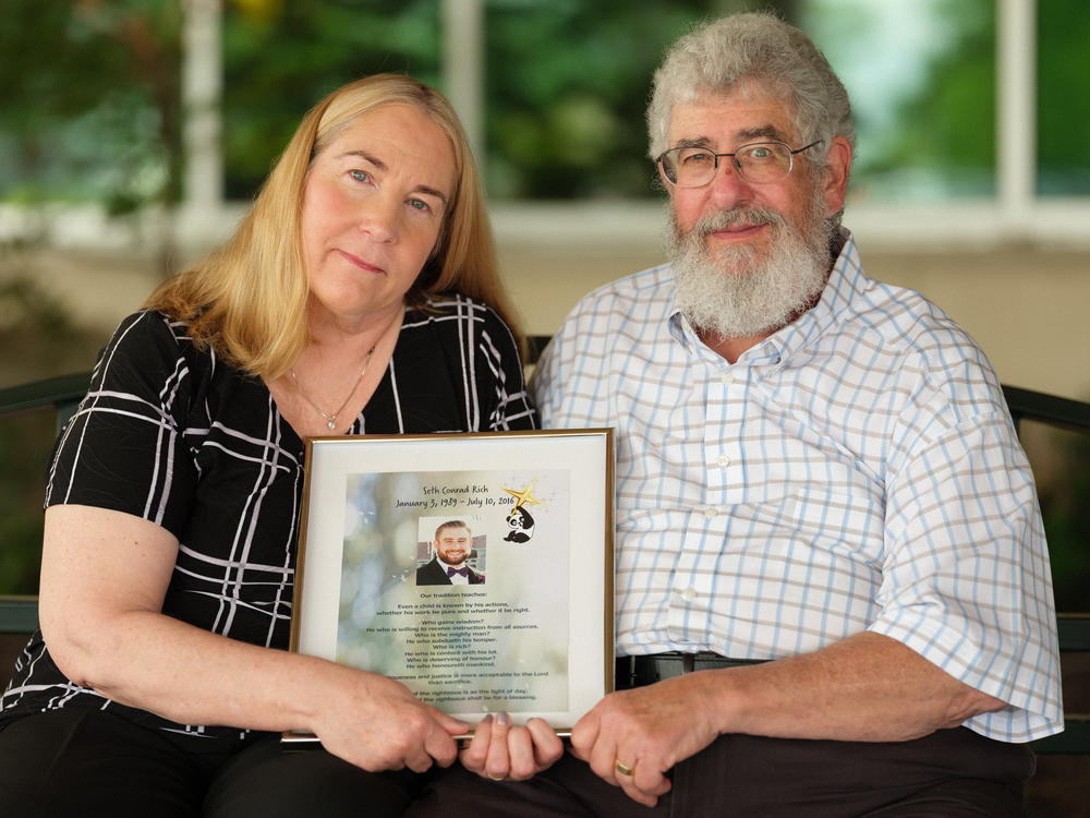 Mary Rich, shown with her husband, Joel, at their home in Omaha, Neb., says self-promoters they trusted to help solve the killing of their son took advantage of them. 
