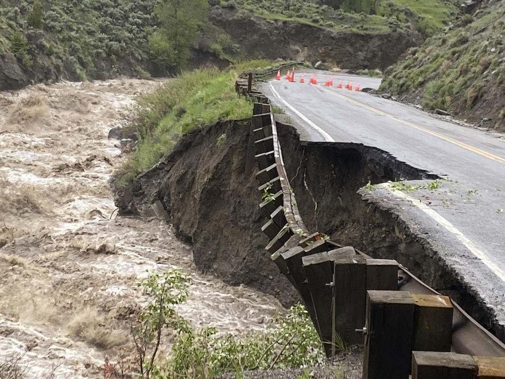 High water in the Gardiner River along the North Entrance to Yellowstone National Park in Montana washed out part of a road on Monday.