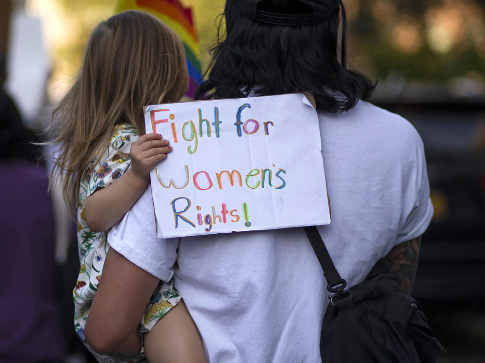 A girl holds a placard as protesters take part in the Women's March and Rally for Abortion Justice in New York, on October 2, 2021.