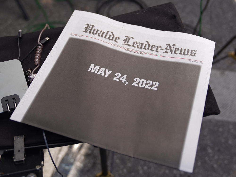 The front page of the local newspaper is seen in the media area outside Robb Elementary School in Uvalde, Texas, on May 26.