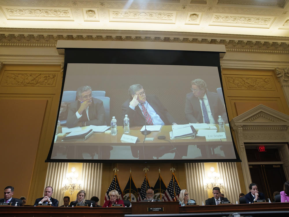 Former Attorney General Bill Barr is displayed on a screen during a hearing of the House select committee investigating the Jan. 6 Capitol attack.