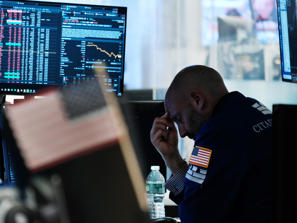 Traders work on the floor of the New York Stock Exchange (NYSE) on Friday in New York City. Stocks slumped on Monday following a stronger-than-expected report on inflation, sending the S&P 500 to a bear market.