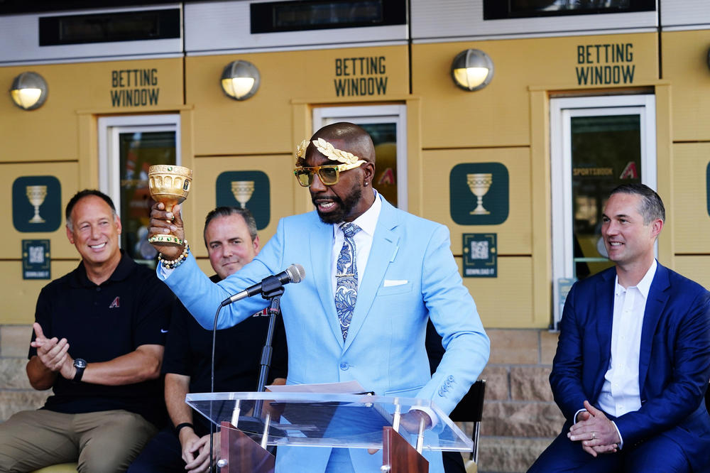 Actor-comedian JB Smoove, representing Caesars Entertainment, speaks as the Arizona Diamondbacks partner with Caesars Entertainment setting up temporary betting windows at Chase Field, home of the Diamondbacks baseball team, during a news conference last summer in Phoenix.