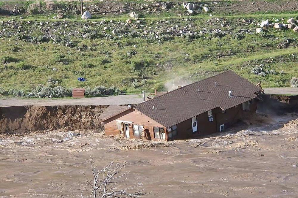 A home near Gardiner falls in to the Yellowstone River.