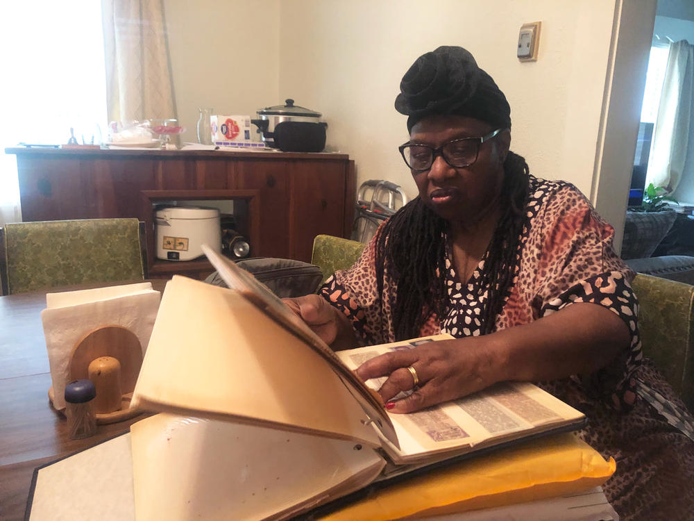 Vermetta Henson, a descendant of Polee and Rose Allen, Clotilda survivors, has done extensive family research, including collecting newspaper obituaries, to create her family tree.