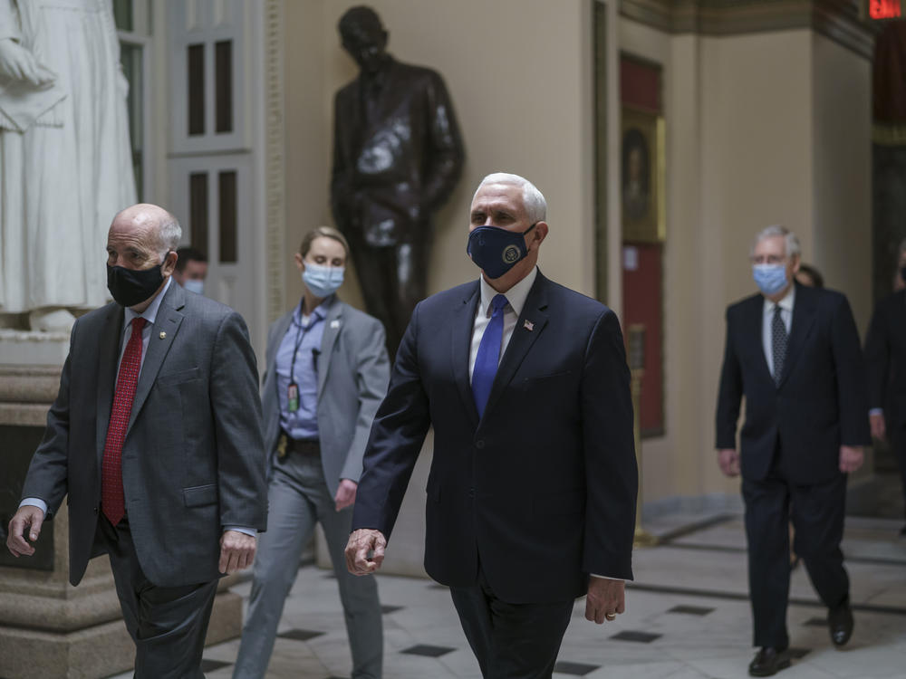 After violent protesters loyal to President Donald Trump stormed the U.S. Capitol on Jan. 6, Vice President Mike Pence leads senators to the House chamber to continue the joint session of the House and Senate and count the Electoral College votes cast in November's election.