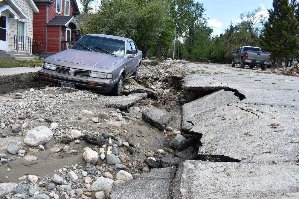 Flood damage is seen along a street Tuesday, June 14, 2022, in Red Lodge, Mont.