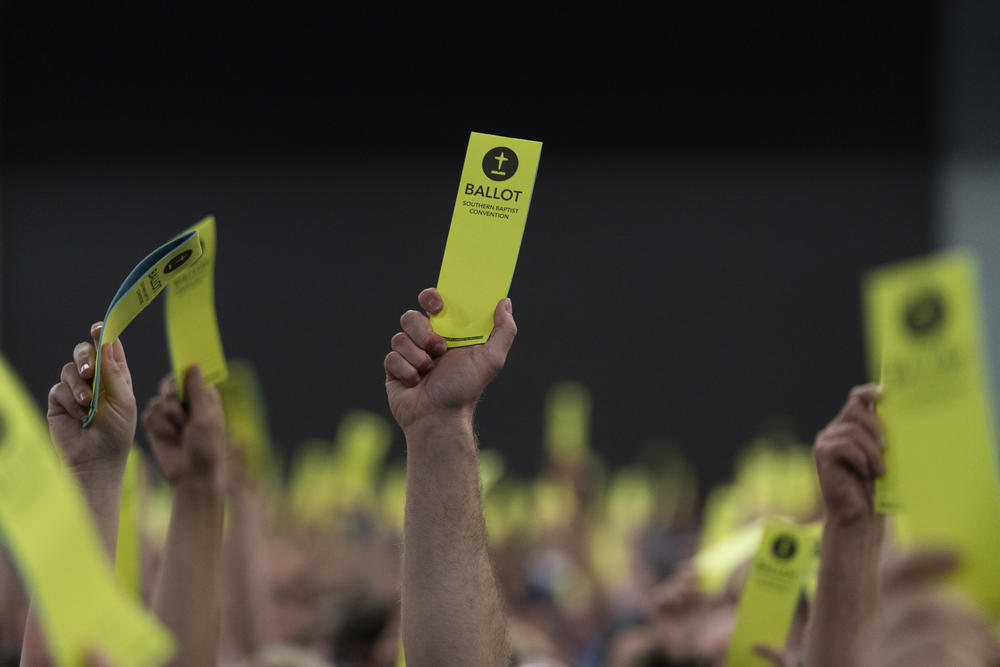 Attendees hold up their ballots during the Southern Baptist Convention's annual meeting in Anaheim, Calif.